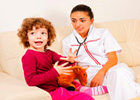 Doctor sitting on a couch with a young girl