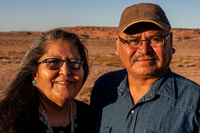 Photo of an American Indian husband and wife near their home in Monument Valley, Utah.