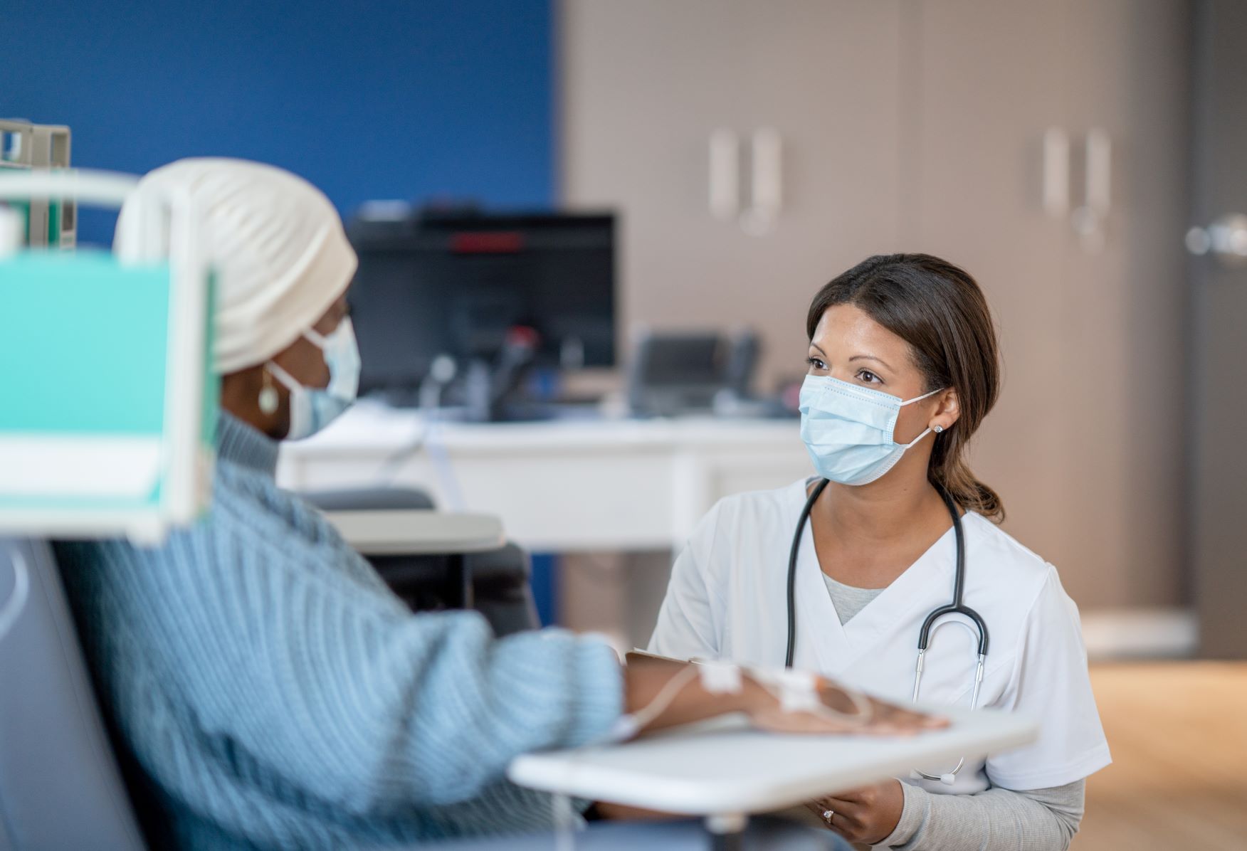 Doctor talking with cancer patient