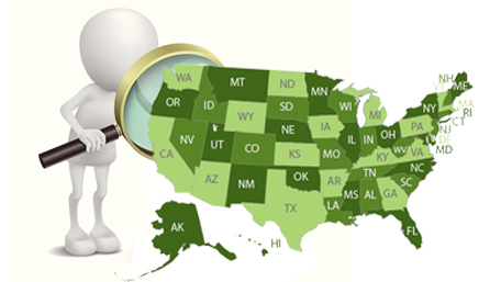 figure with magnifying glass looking at the US map