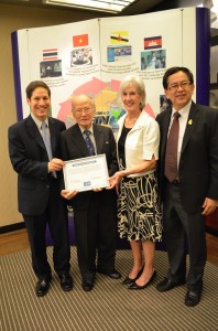 CDC Director Dr. Tom Frieden and HHS Secretary Kathleen Sebelius present a commemoration certificate to Dr. Sujarti Jatanasen, the founding father of the Thailand Field Epidemiology Training Program (FETP)