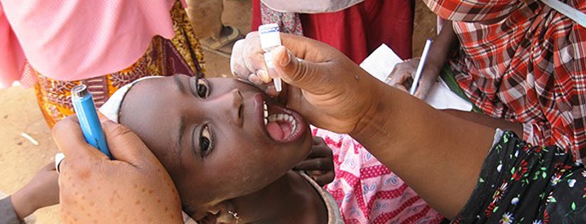 With her head tilted back, the picture depicts a young Nigerian girl, as she was holding her mouth wide open in order to receive her dose of orally-administered polio vaccine. This activity was taking place during Nigeria’s National - Stop Transmission of Polio Program (N-STOP), which is a refined and specialized offspring of two larger programs that train disease detectives: the (international) STOP program, and the Nigeria Field Epidemiology and Laboratory Training Program. N-STOP is a key element in Nigeria’s effort to rid the country of this crippling disease.