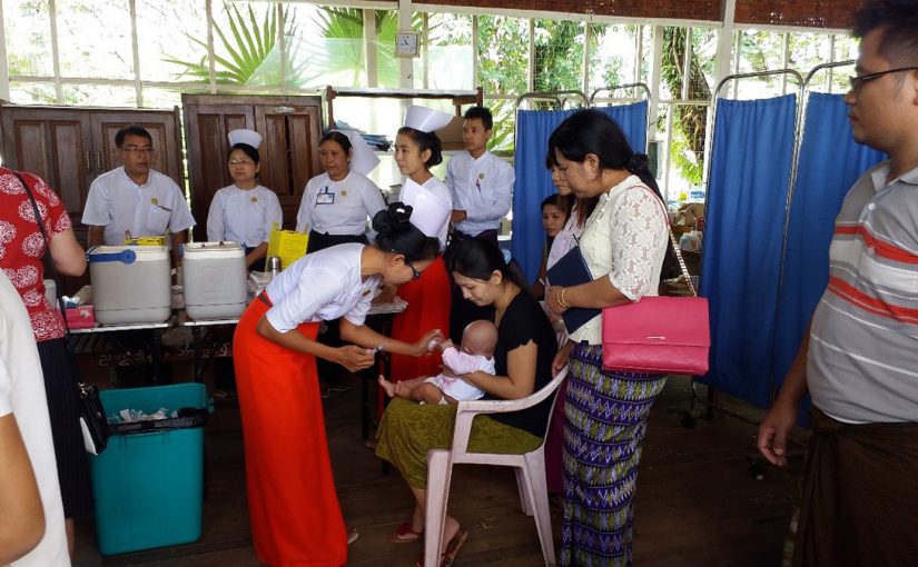 Midwife providing the 5-in-1 pentavalent vaccine (diphtheria-tetanus-pertussis [DTP], hepatitis B, and Haemophilus influenzae type b) during a routine vaccination session in Myanmar