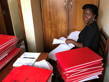 FETP Resident Pheobe Hilda Alitubeera searching for tetanus cases in health facility registers.