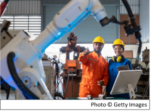 workers in hard hats in a manufacturing setting