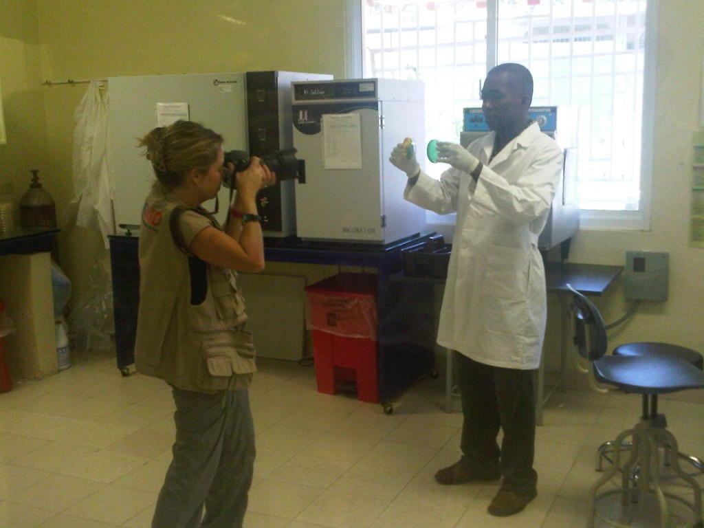 USAID photographer Kendra Helmer taking pictures in the lab.