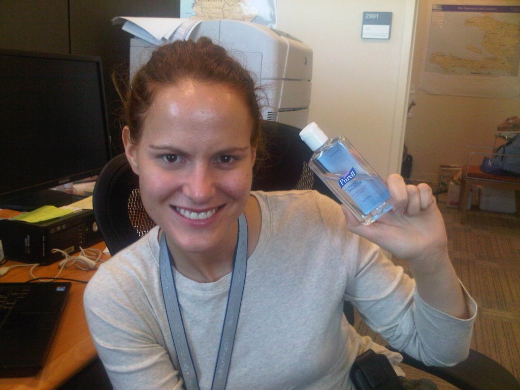 Emily McCormick holding bottle of hand sanitizer.