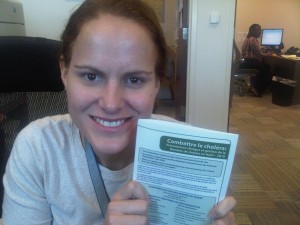 Emily McCormick holding a clinical treatments guidelines brochure.