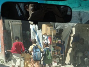Araceli taking pictures of the streets of Haiti from her car