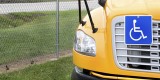 close up image of a school bus with handicap sign