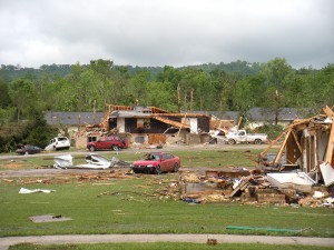 building and cars destroyed by a tornado