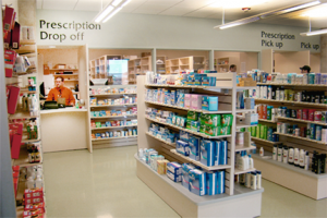 Picture of a pharmacy counter taken from one of the aisles