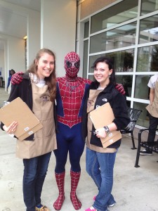 Emory students standing with Spiderman at a fundraiser event