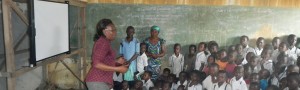 Teacher speaking with students in the Democratic Republic of Congo
