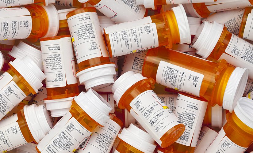 A jumble of prescription pill bottles