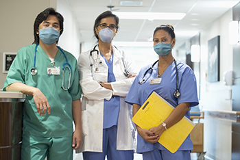 healthcare workers wearing scrubs and masks
