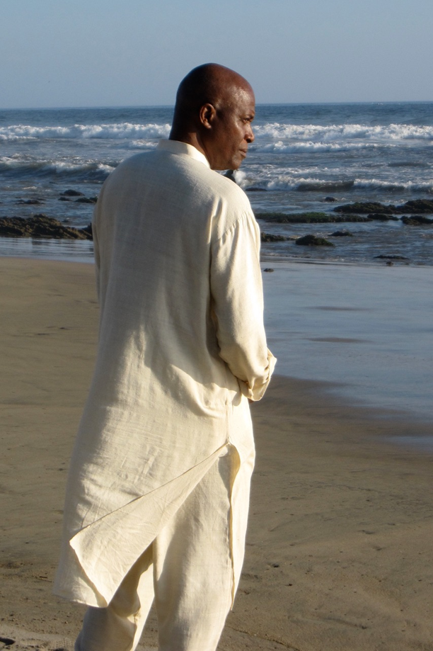 Yogiraj Charles Bates on a beach