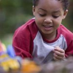 Child enjoys playing in the dirt (CDC PHIL) 