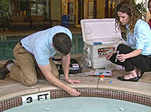 Investigators sample a hot tub 