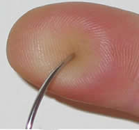 blunt-tipped needle pressing on but not breaking skin