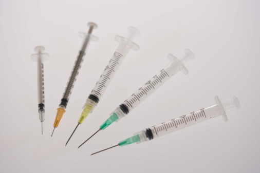 a row of hyperdermic needles