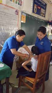 A nine-year old girl being vaccinated with HPV vaccine in a primary school in Siem Reap Province
