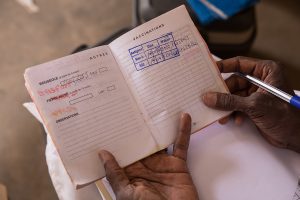 A childhood immunization record from Burkina Faso, 2017. © Evelyn Hockstein/CDC Foundation