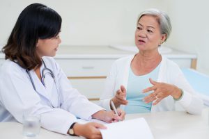 Photo of a woman talking to her doctor