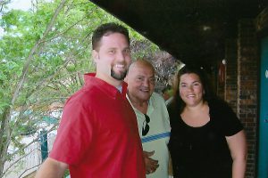 Photo of Sherri Stewart, her husband Troy Querec, and her grandfather