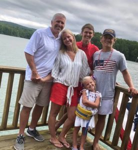 Family picture outside at a lake