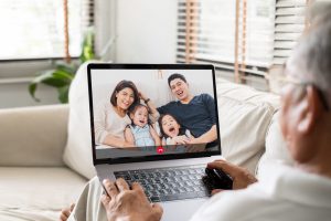 Asian old senior video call virtual meeting with family