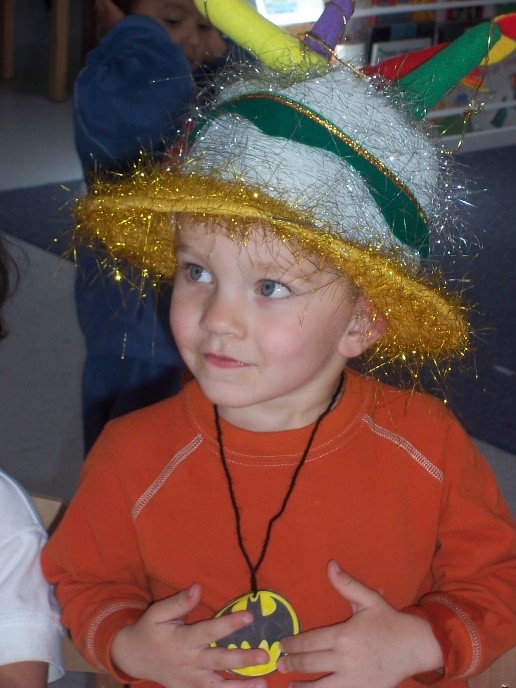 Mason wearing a decorative hat