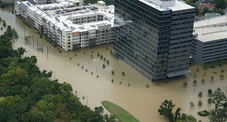 Photo of a flooded apartment complex and office building during Hurricane Harvey.