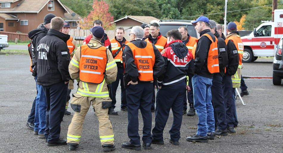 Emergency responders gathered in a circle.