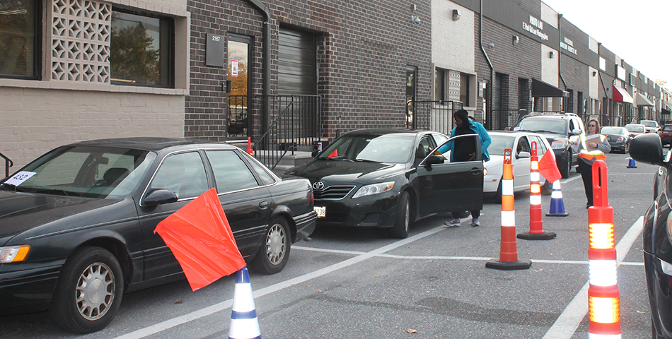 A line of vehicles at a point of dispensing drill