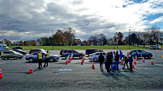 Vehicles line up to participate in a drive-thru flu clinic in Bethlehem, Pa.