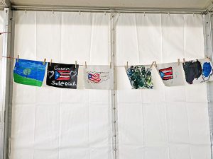 CDC – Puerto Pico Earthquake Response – paintings hanging on a line.